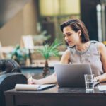 Businesswoman writing documents