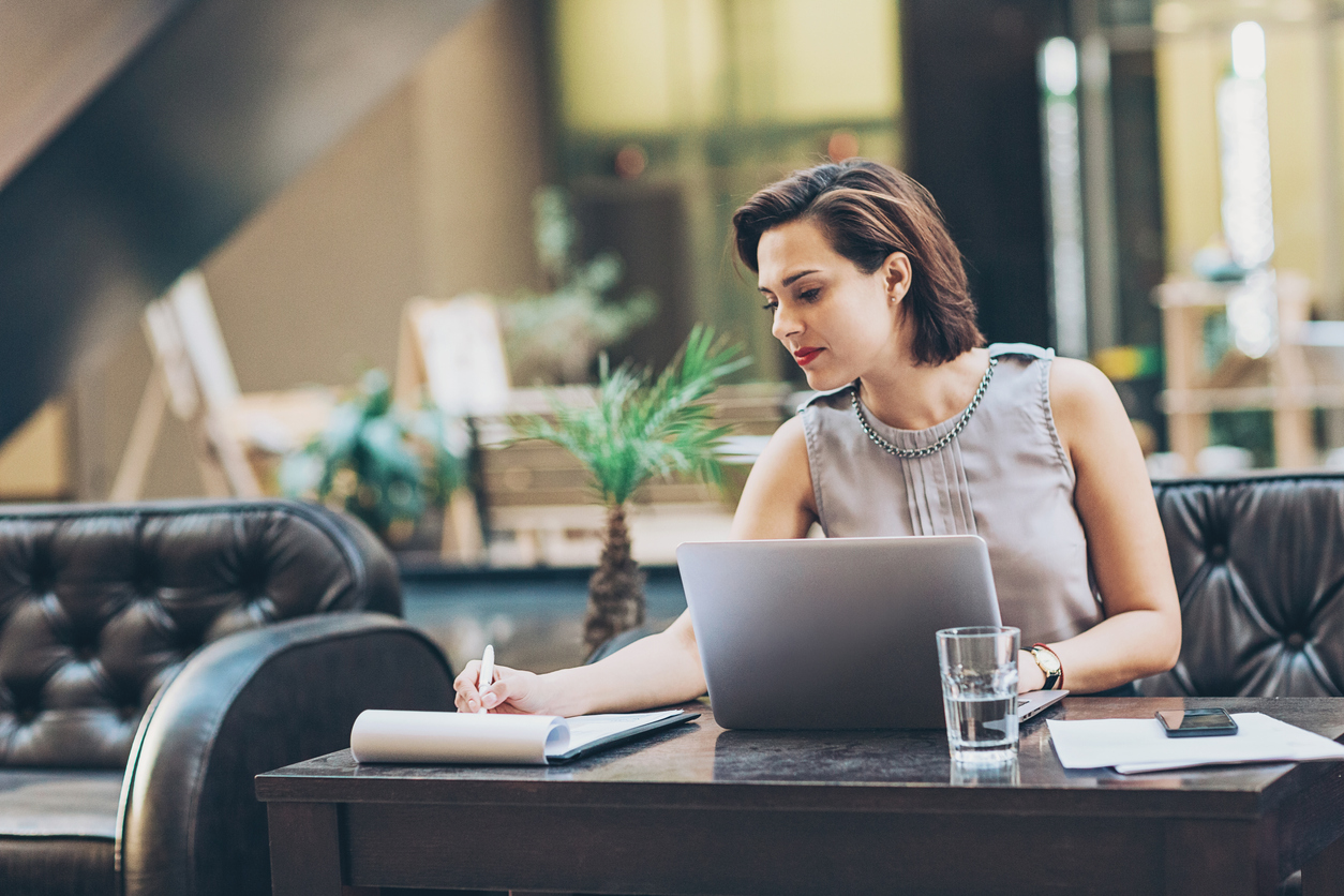 Businesswoman writing documents